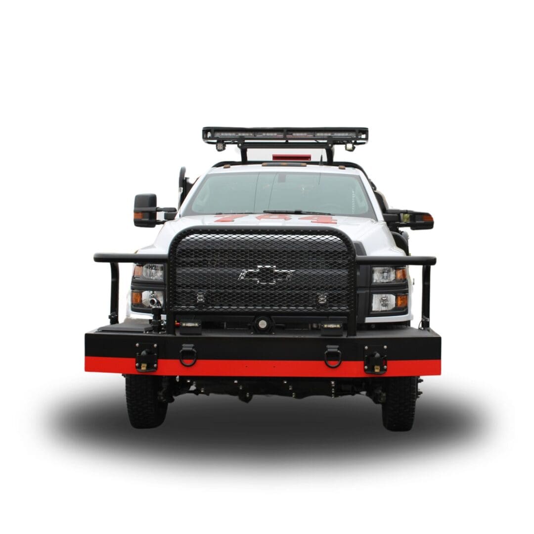 White truck with black grille and red bumper.