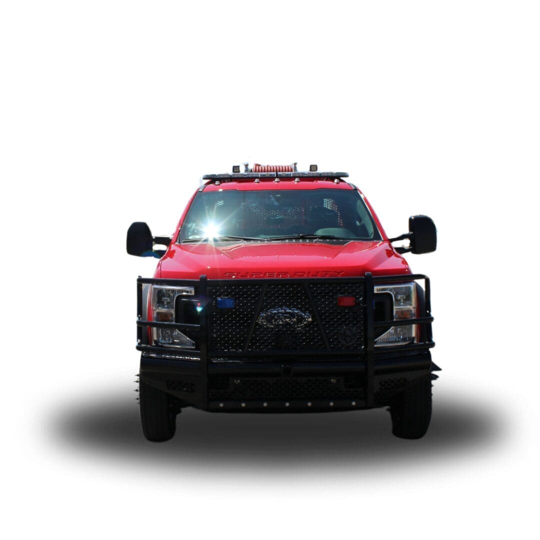 Red Ford Super Duty truck with lights.