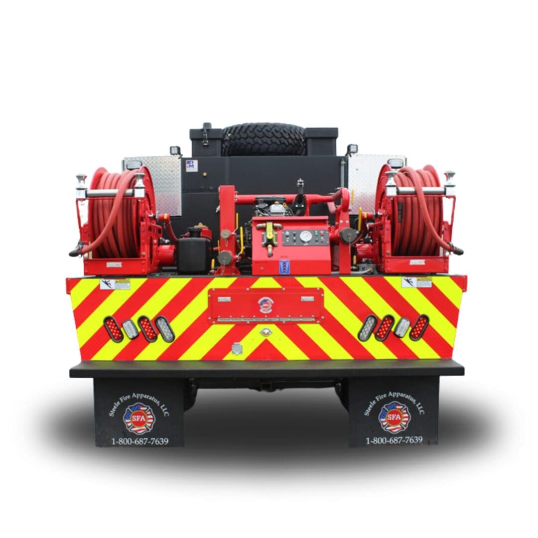 Red fire truck with hose reels and lights.