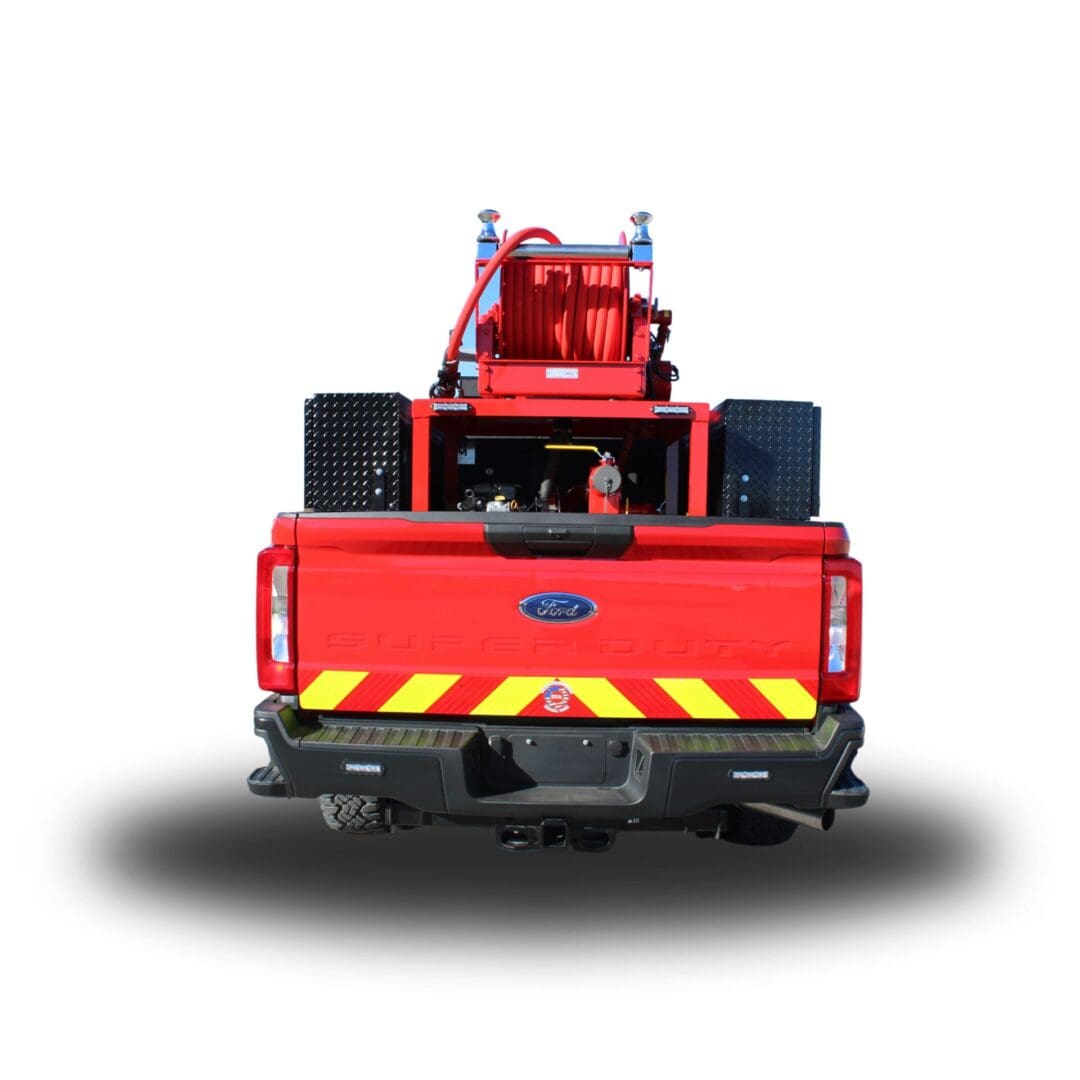 Red Ford F-Series fire truck with hose reel.