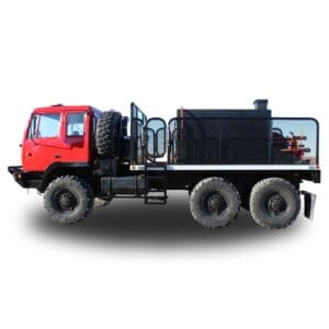 Red flatbed truck with black tank.