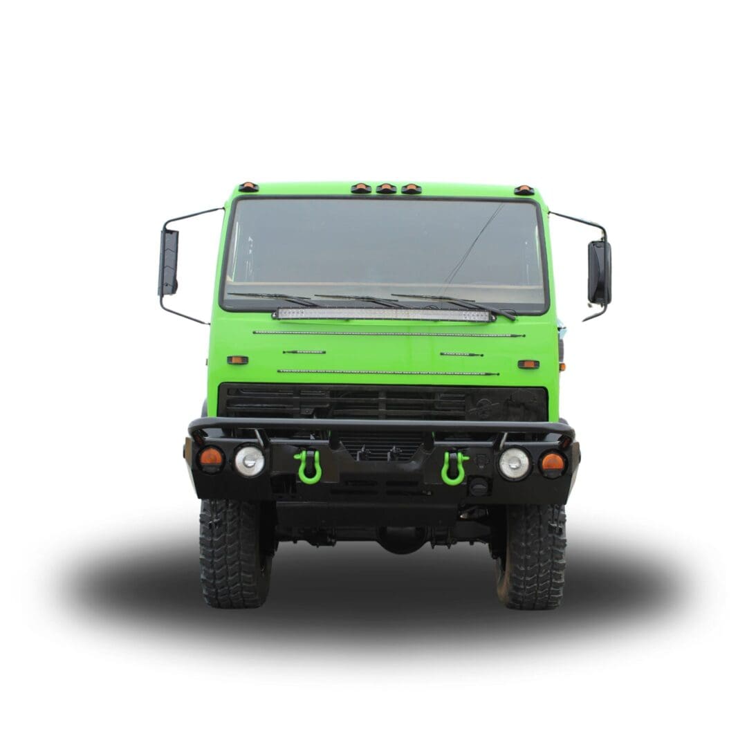 Green truck with black bumper and tow hooks.