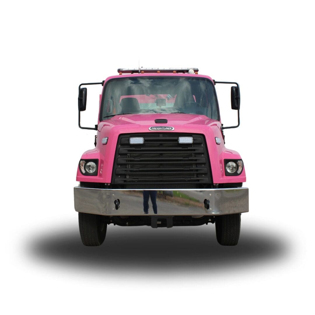 Pink Freightliner tow truck front view.