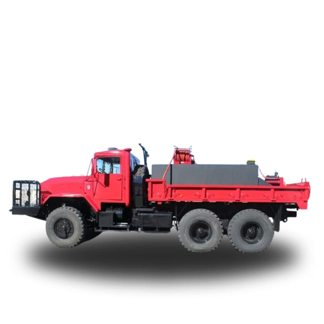 Red fire truck with flatbed and hoses.