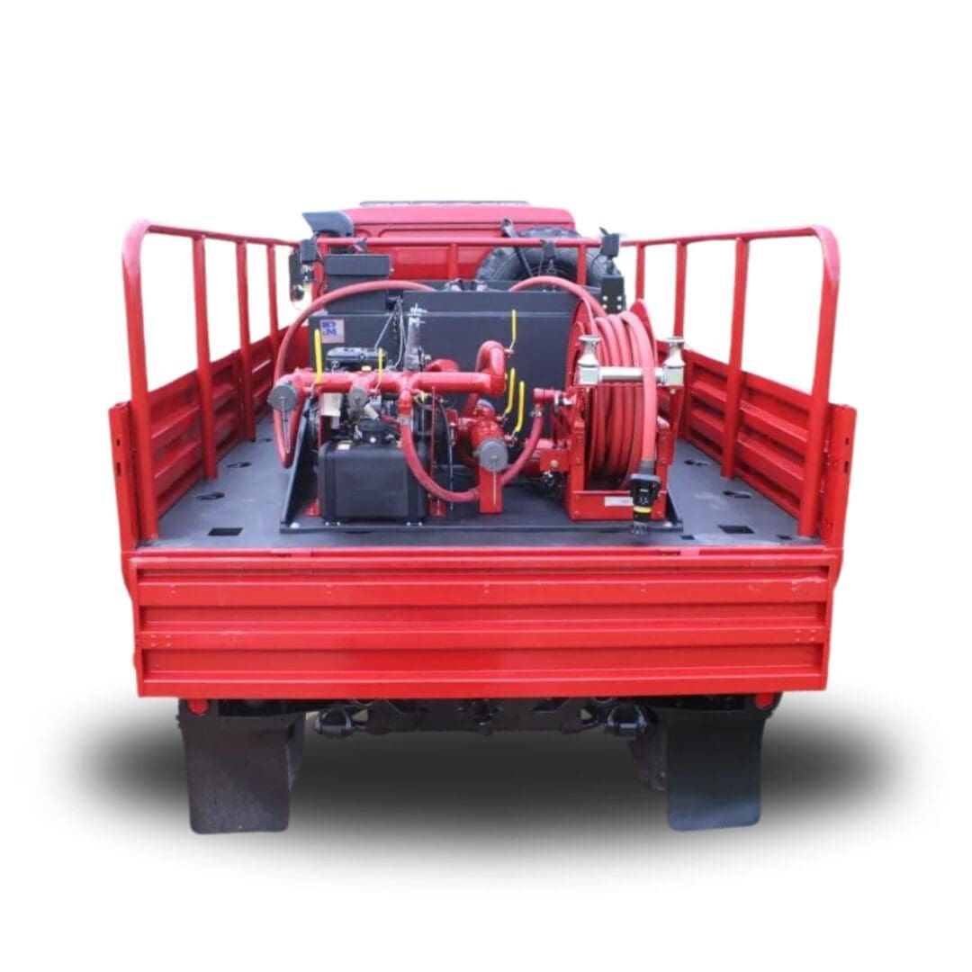 Red fire truck with hoses and pump.