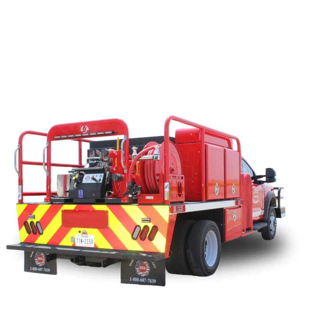 Red fire truck with hose reel and lights.